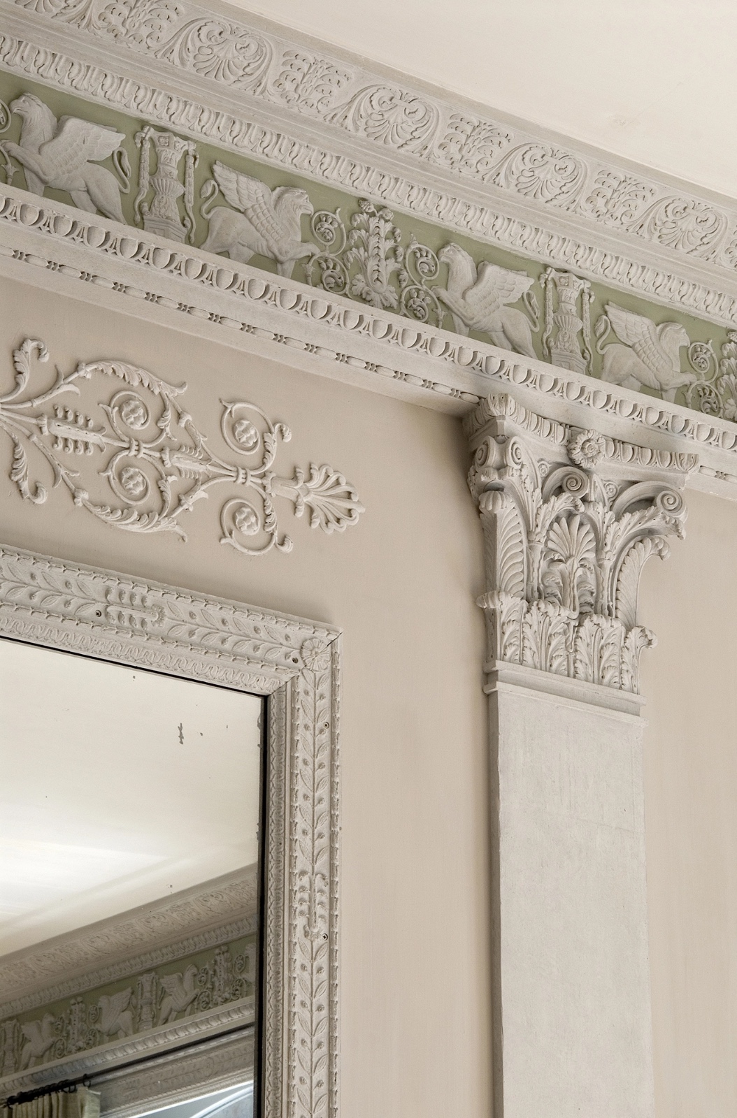 Close-up of carved limestone detail and classical capital work